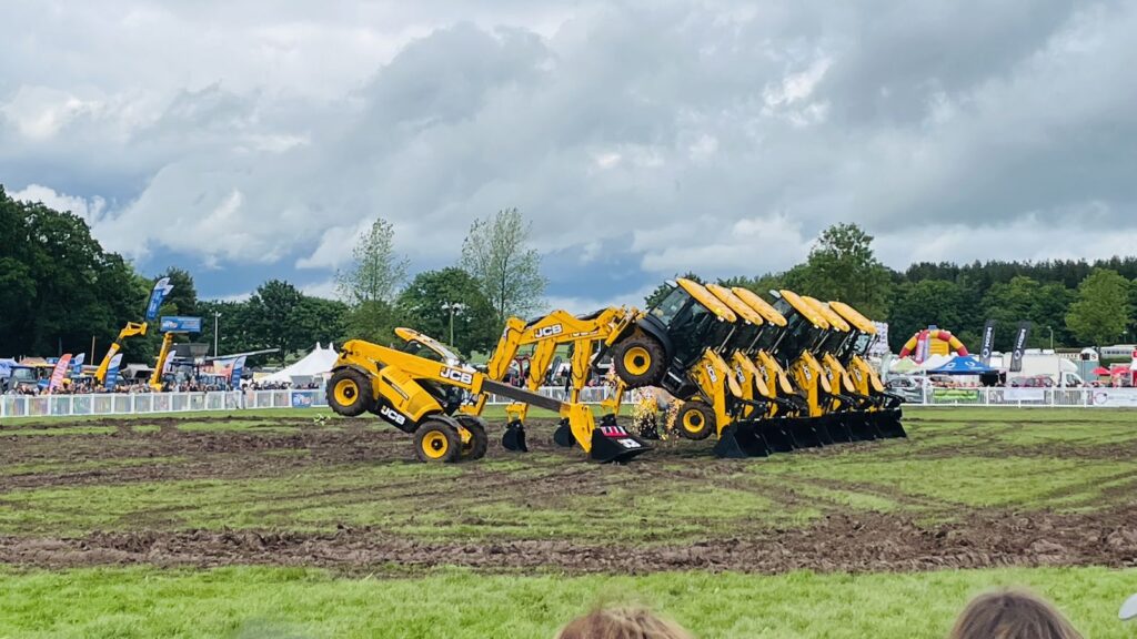 The JCB Dancing Diggers performing in the main ring at Staffordshire County Show