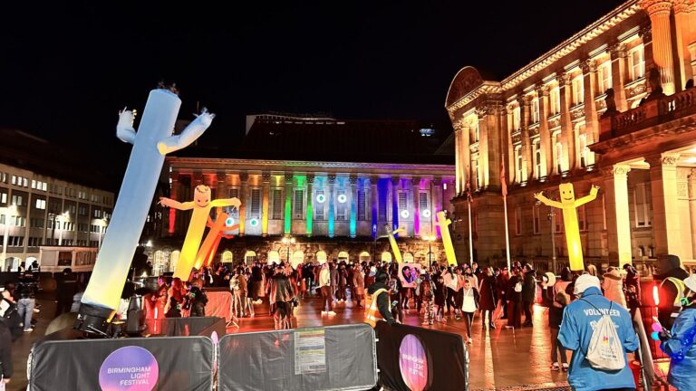 Inflatable light figures and crowds outside the Council House at Birmingham Light Festival