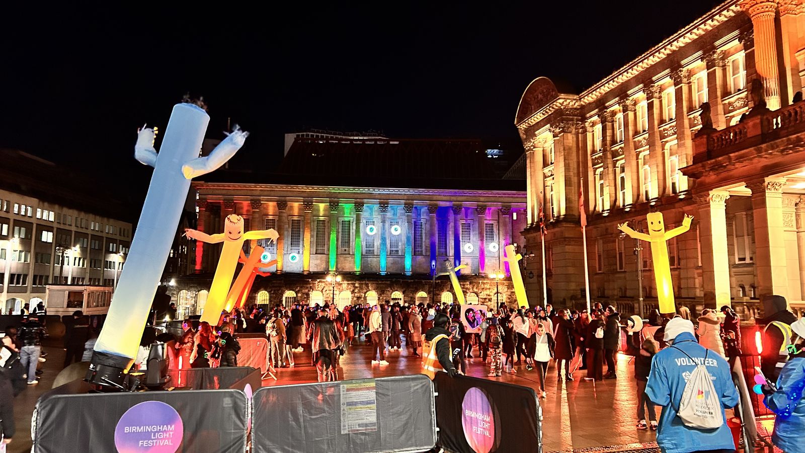 Inflatable light figures and crowds outside the Council House at Birmingham Light Festival